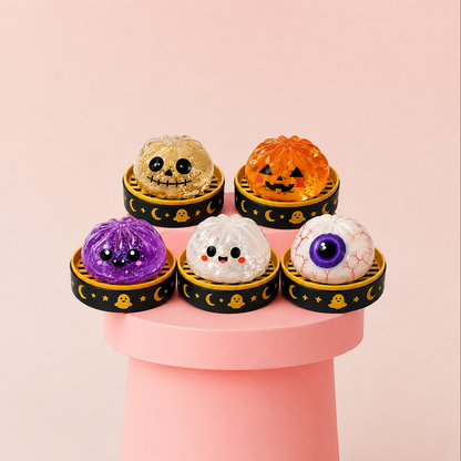 Cute Halloween squishy stress relief toys featuring pumpkin, ghost and eyeball designs for sensory play, fidgeting, party favors and Halloween gifts.