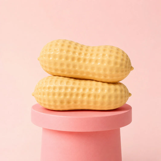Soft peanut-shaped squishy stress relief toy with realistic textured shell, a satisfying squeeze and fidget toy for sensory play and relaxation.