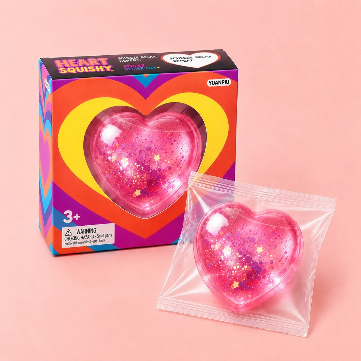 Pink glitter heart squishy squeeze toy with colorful packaging, a soft sensory fidget toy for stress relief, relaxation and cute gift ideas.