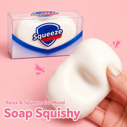 White soap-shaped squishy stress relief toy being squeezed by hand, a soft satisfying fidget and squeeze toy for adults and everyday relaxation.